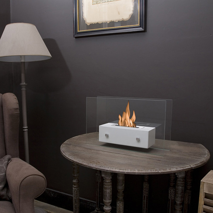 Petit modèle de cheminée à poser sur un meuble - Crédit internet